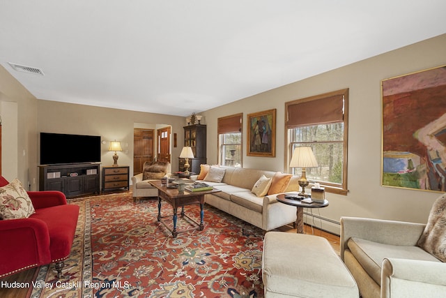 4 Mountain View Dr, Kerhonkson, NY 12446 - living room with baseboard heating, wood finished floors, and baseboards