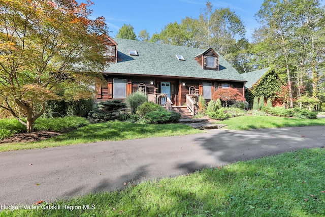 4 Mountain View Dr, Kerhonkson, NY 12446 - view of front of home with roof with shingles and a front lawn