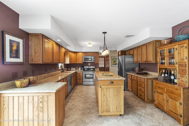 4 Mountain View Dr, Kerhonkson, NY 12446 - kitchen with appliances with stainless steel finishes, a sink, a kitchen island, brown cabinets, and light stone countertops