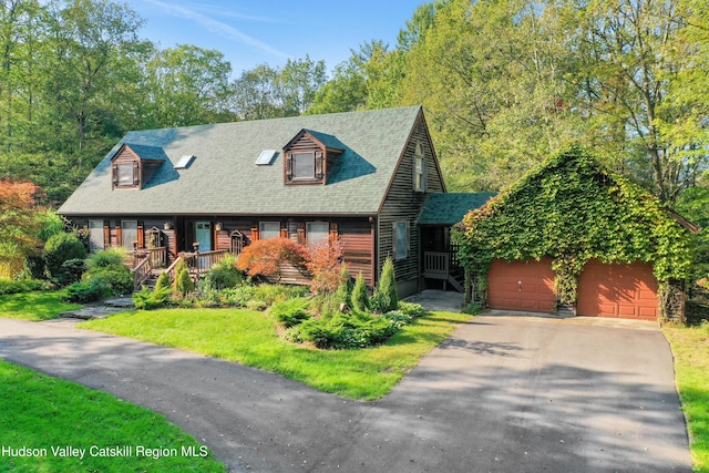 4 Mountain View Dr, Kerhonkson, NY 12446 - view of front facade with a porch, a garage, a shingled roof, and asphalt driveway