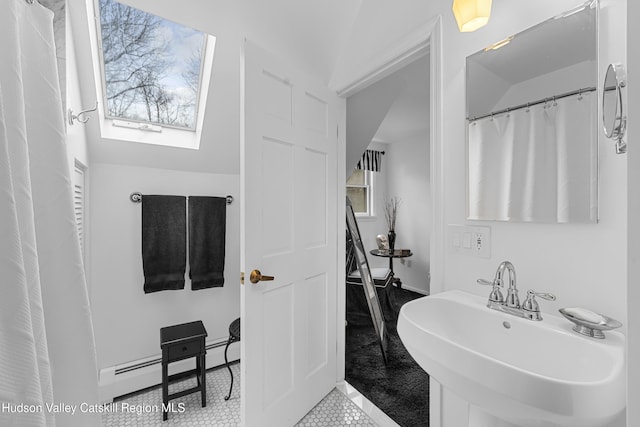 4 Mountain View Dr, Kerhonkson, NY 12446 - full bath with a sink, tile patterned flooring, a skylight, a baseboard radiator, and baseboards