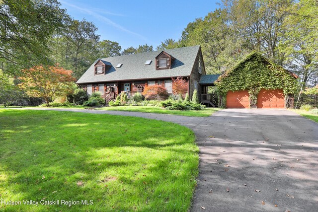 4 Mountain View Dr, Kerhonkson, NY 12446 - view of front of property featuring an attached garage, driveway, a front lawn, covered porch, and roof with shingles