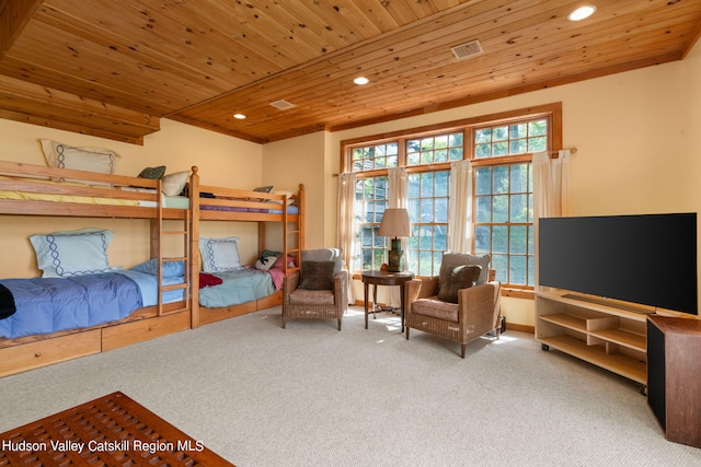 bedroom with carpet flooring, multiple windows, and wooden ceiling