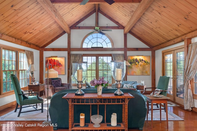 living room featuring a wealth of natural light, french doors, and hardwood / wood-style flooring