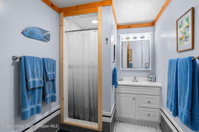 bathroom with baseboard heating, a shower with curtain, and vanity