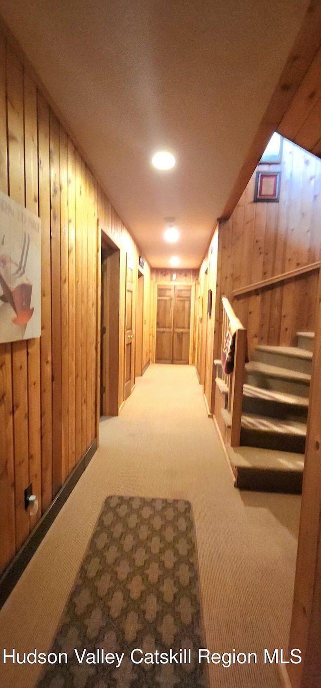 490 Mill St, Windham, NY 12496 - corridor featuring carpet floors, wooden walls, and stairway