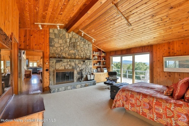 490 Mill St, Windham, NY 12496 - bedroom with access to exterior, wooden ceiling, wooden walls, and a stone fireplace