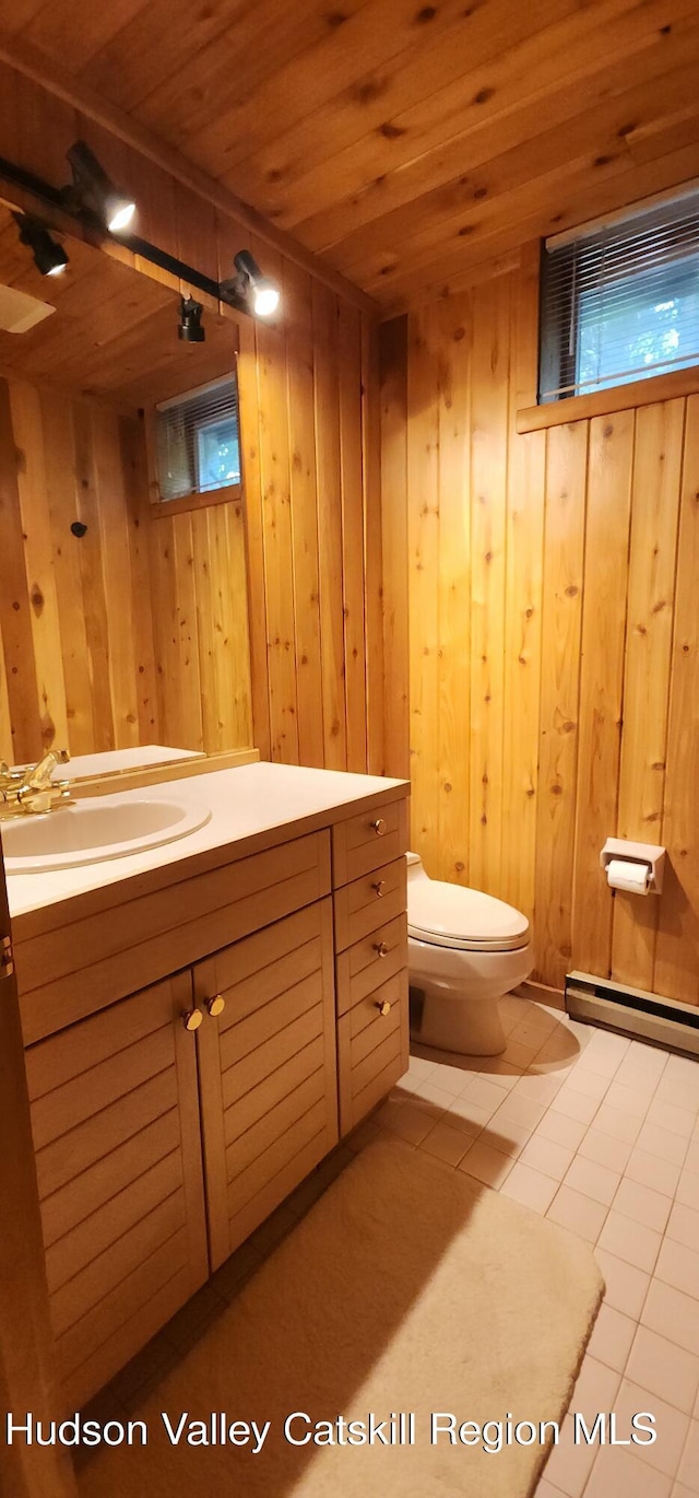 490 Mill St, Windham, NY 12496 - bathroom with vanity, wood walls, tile patterned flooring, a baseboard heating unit, and wood ceiling