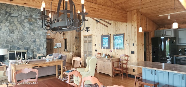 490 Mill St, Windham, NY 12496 - kitchen featuring black appliances, wood finished floors, wooden ceiling, a chandelier, and wooden walls