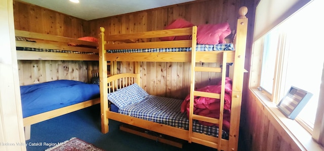 490 Mill St, Windham, NY 12496 - bedroom with wooden walls and carpet