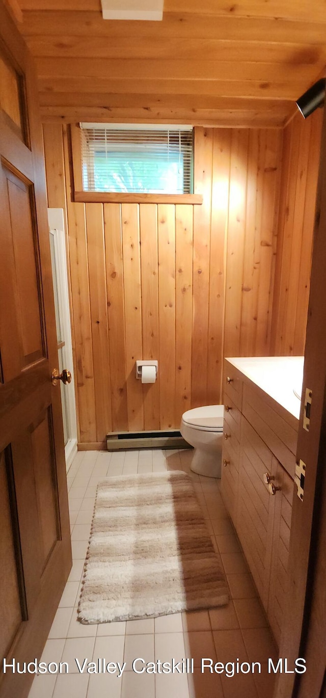 490 Mill St, Windham, NY 12496 - half bath featuring vanity, tile patterned flooring, wood walls, wooden ceiling, and baseboard heating