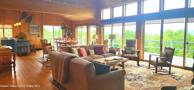 490 Mill St, Windham, NY 12496 - living room with wood-type flooring, wood walls, and high vaulted ceiling