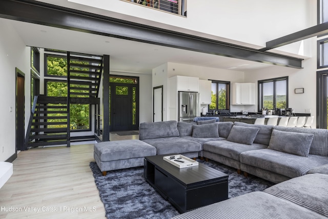 4 Goff Rd, Windham, NY 12496 - living room featuring light wood-style floors and a towering ceiling