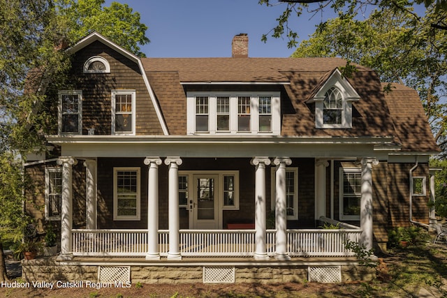 131 William St, Catskill, NY 12414 - view of front of home with a porch, a chimney, roof with shingles, and a gambrel roof