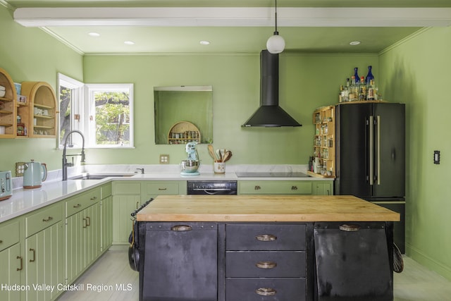 131 William St, Catskill, NY 12414 - kitchen with wall chimney exhaust hood, butcher block countertops, black appliances, a kitchen island, and green cabinets