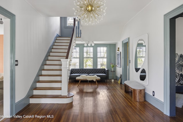 131 William St, Catskill, NY 12414 - foyer entrance with stairway, a chandelier, hardwood / wood-style floors, and baseboards