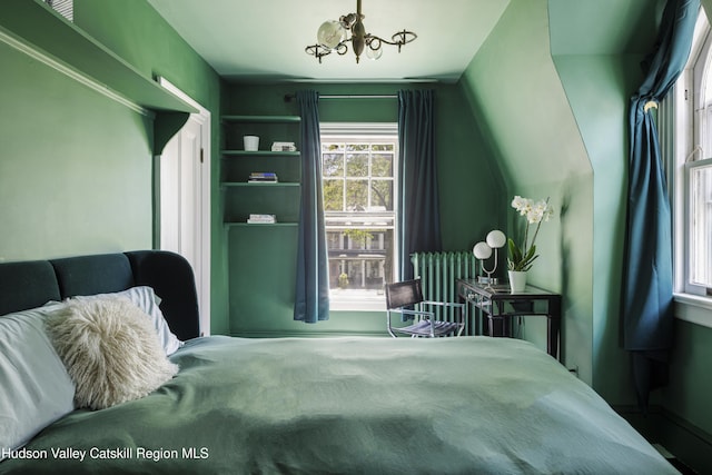 131 William St, Catskill, NY 12414 - bedroom with multiple windows, a chandelier, and baseboards