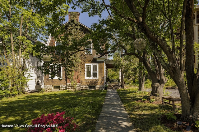 131 William St, Catskill, NY 12414 - view of front of property with a front yard and a chimney