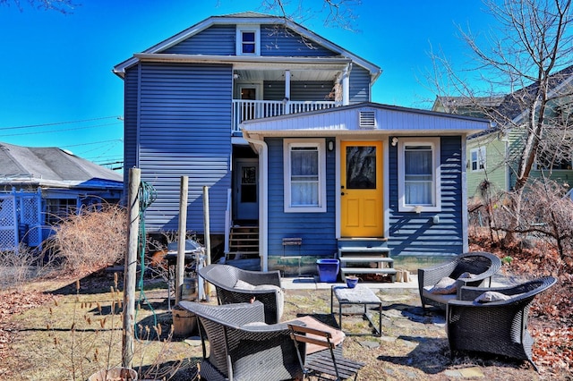 825 Union St, Hudson, NY 12534 - back of house with entry steps and a balcony