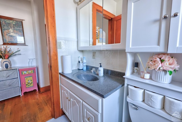 825 Union St, Hudson, NY 12534 - bar with a sink, decorative backsplash, and dark wood finished floors