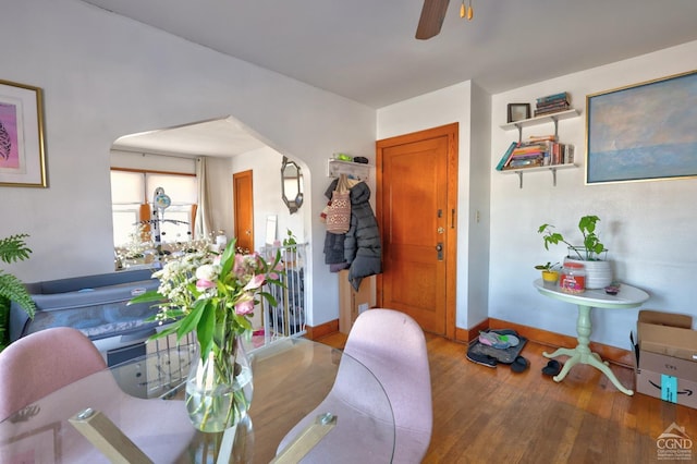 825 Union St, Hudson, NY 12534 - dining space featuring wood finished floors, a ceiling fan, and baseboards