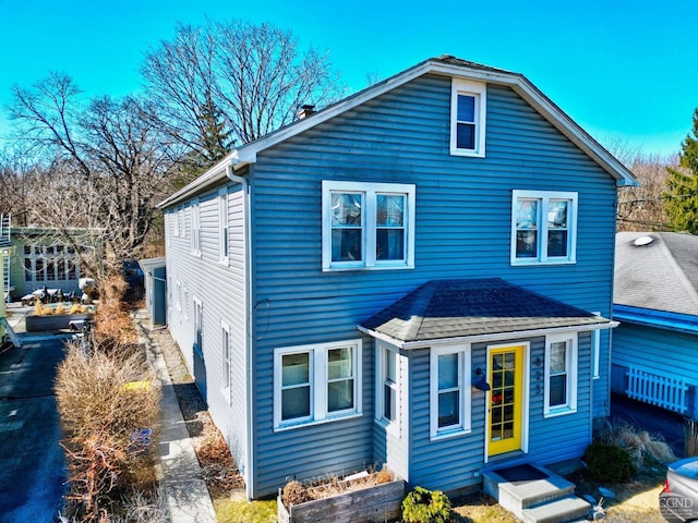 825 Union St, Hudson, NY 12534 - back of house featuring a shingled roof and a chimney