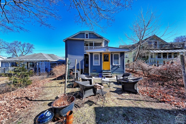 825 Union St, Hudson, NY 12534 - rear view of property with a balcony and entry steps