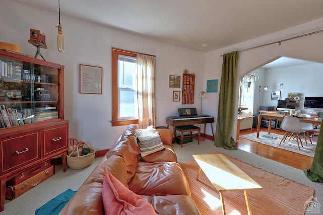 825 Union St, Hudson, NY 12534 - living area with healthy amount of natural light, a desk, and arched walkways