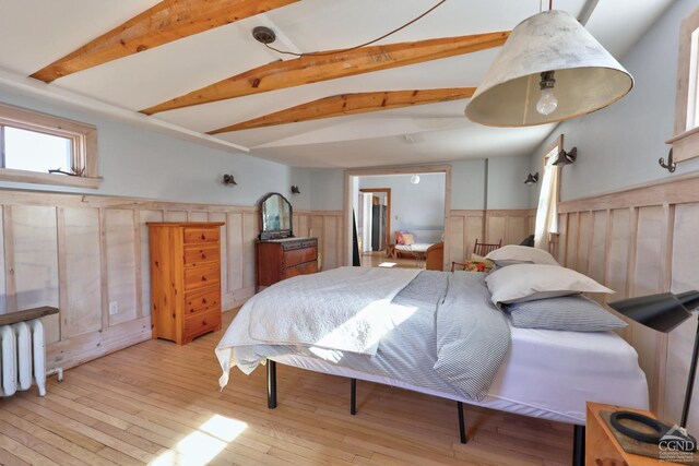 825 Union St, Hudson, NY 12534 - bedroom featuring a wainscoted wall, beam ceiling, and light wood-style floors