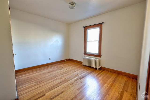 825 Union St, Hudson, NY 12534 - empty room featuring radiator heating unit, baseboards, and light wood-style flooring