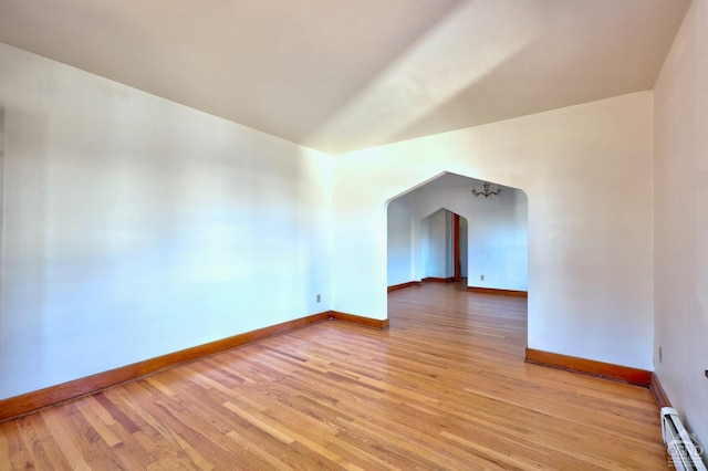825 Union St, Hudson, NY 12534 - additional living space with a baseboard radiator, baseboards, and light wood-type flooring