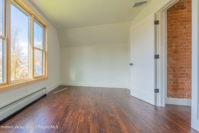 bonus room featuring lofted ceiling, a baseboard radiator, visible vents, and a wealth of natural light