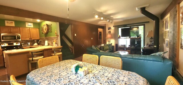 56 Highlands Dr Unit F3, Hunter, NY 12442 - dining area with a wood stove