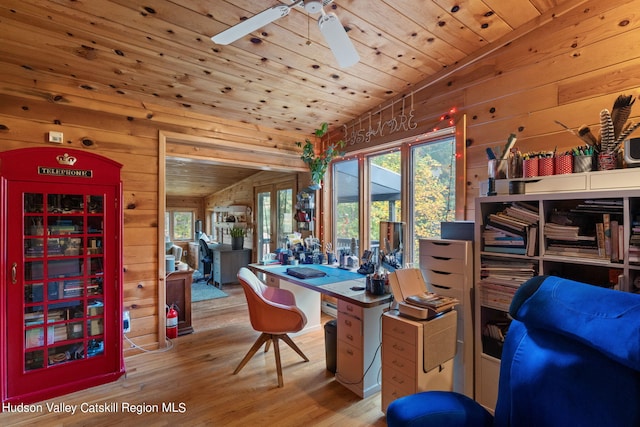 office space with wood-type flooring, wood ceiling, a wealth of natural light, and vaulted ceiling