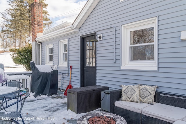 view of snow covered property entrance