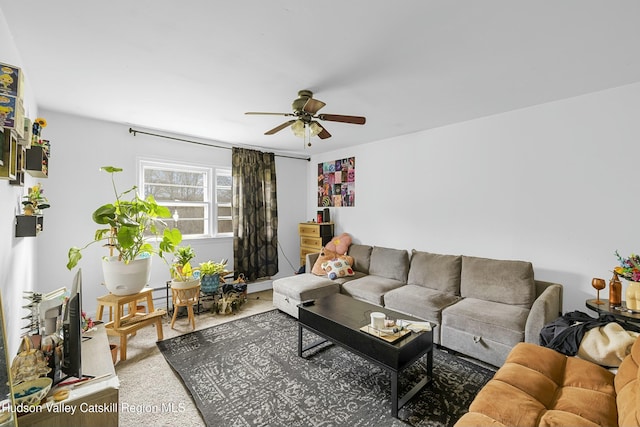 living room featuring ceiling fan