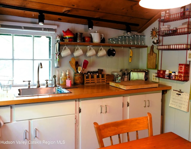 3 Dymond Rd, Kerhonkson, NY 12446 - kitchen featuring a sink, white cabinetry, open shelves, and vaulted ceiling