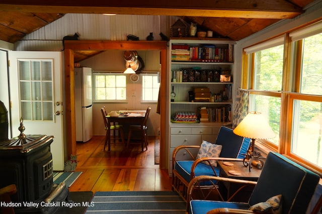 3 Dymond Rd, Kerhonkson, NY 12446 - living area with lofted ceiling, a wood stove, hardwood / wood-style flooring, and plenty of natural light