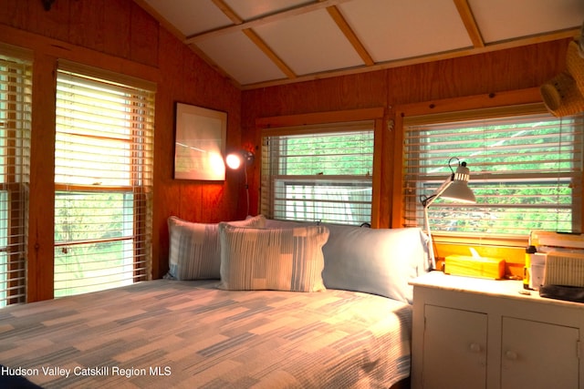3 Dymond Rd, Kerhonkson, NY 12446 - bedroom featuring vaulted ceiling, carpet flooring, and wooden walls