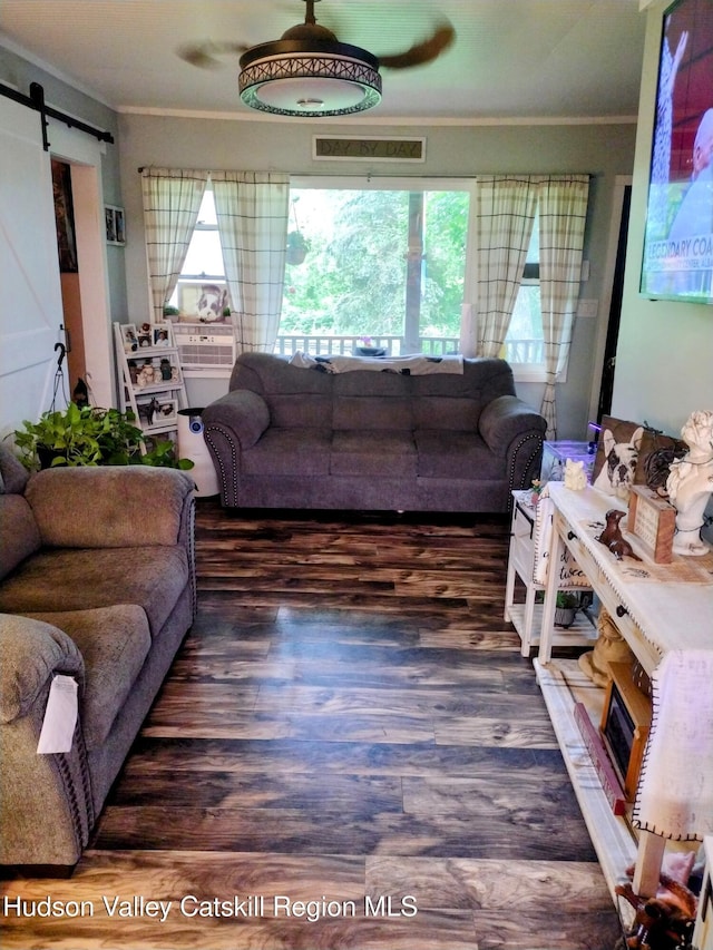 4 Tanners Ln, Hudson, NY 12534 - living area with crown molding, healthy amount of natural light, a barn door, and wood finished floors