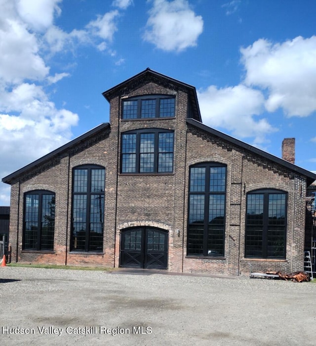 4 Tanners Ln, Hudson, NY 12534 - view of side of home with brick siding and a chimney