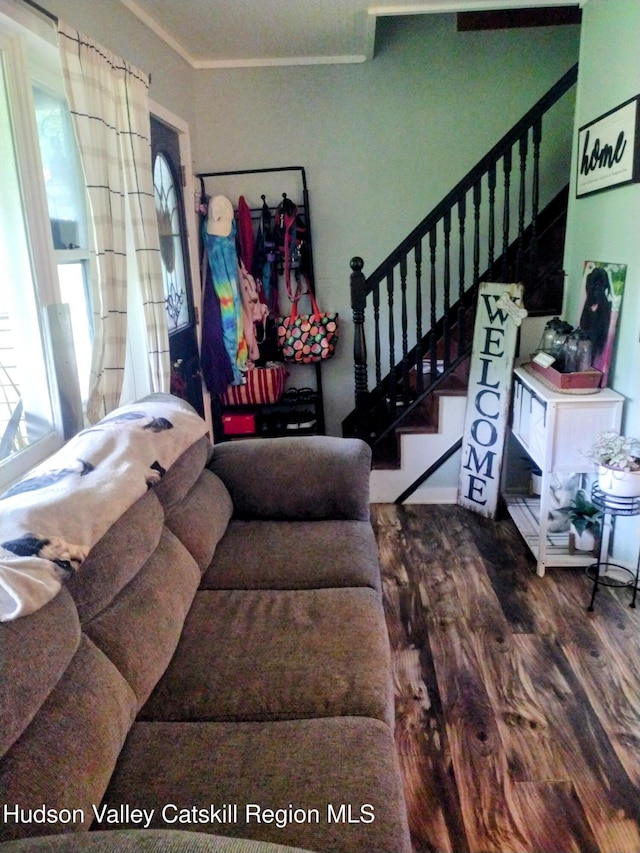 4 Tanners Ln, Hudson, NY 12534 - living room with healthy amount of natural light, ornamental molding, stairway, and wood finished floors