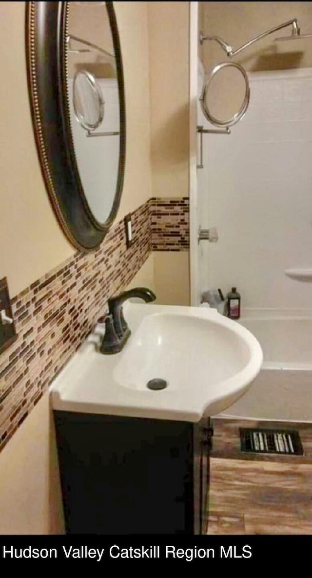 4 Tanners Ln, Hudson, NY 12534 - full bath featuring vanity, a shower, and tile walls