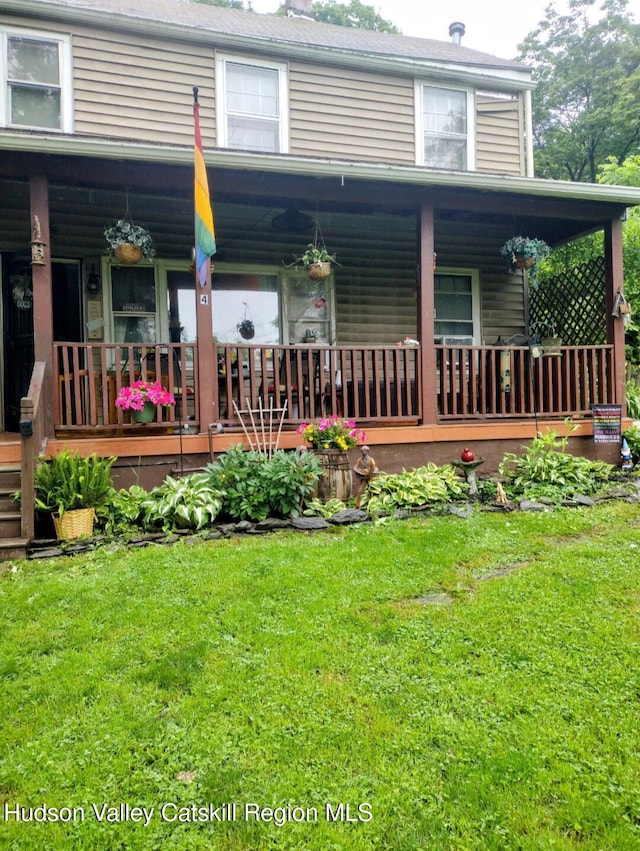 4 Tanners Ln, Hudson, NY 12534 - back of house featuring covered porch and a lawn