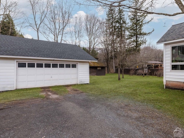 garage featuring driveway