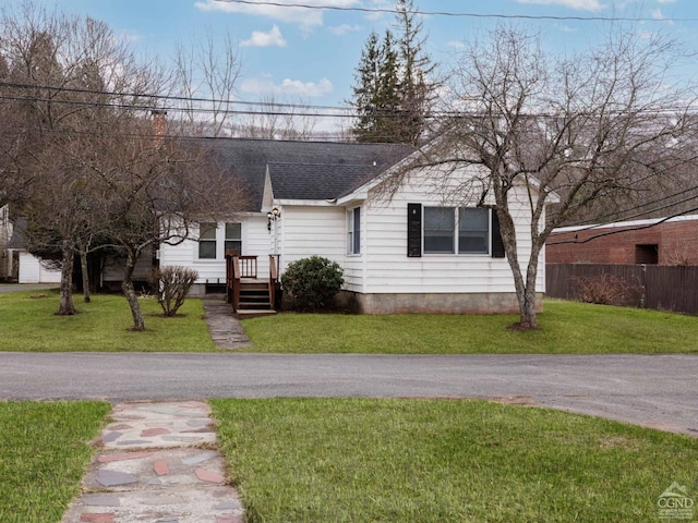 view of front of property with a chimney and a shingled roof