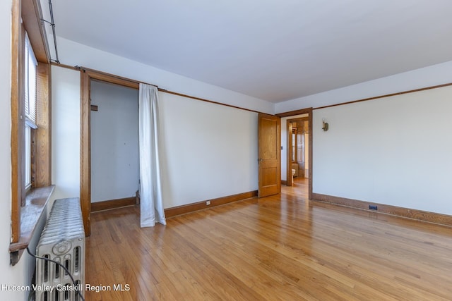 unfurnished room featuring light hardwood / wood-style floors