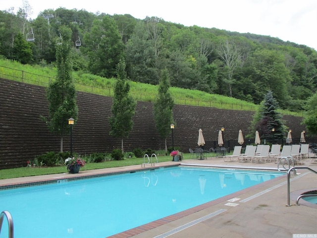 62 Liftside Dr Unit 432K4, Hunter, NY 12442 - community pool featuring fence, a patio, and a wooded view