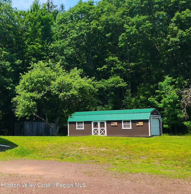 273 E Conesville Rd, Conesville, NY 12076 - view of front of property with an outbuilding and a metal roof