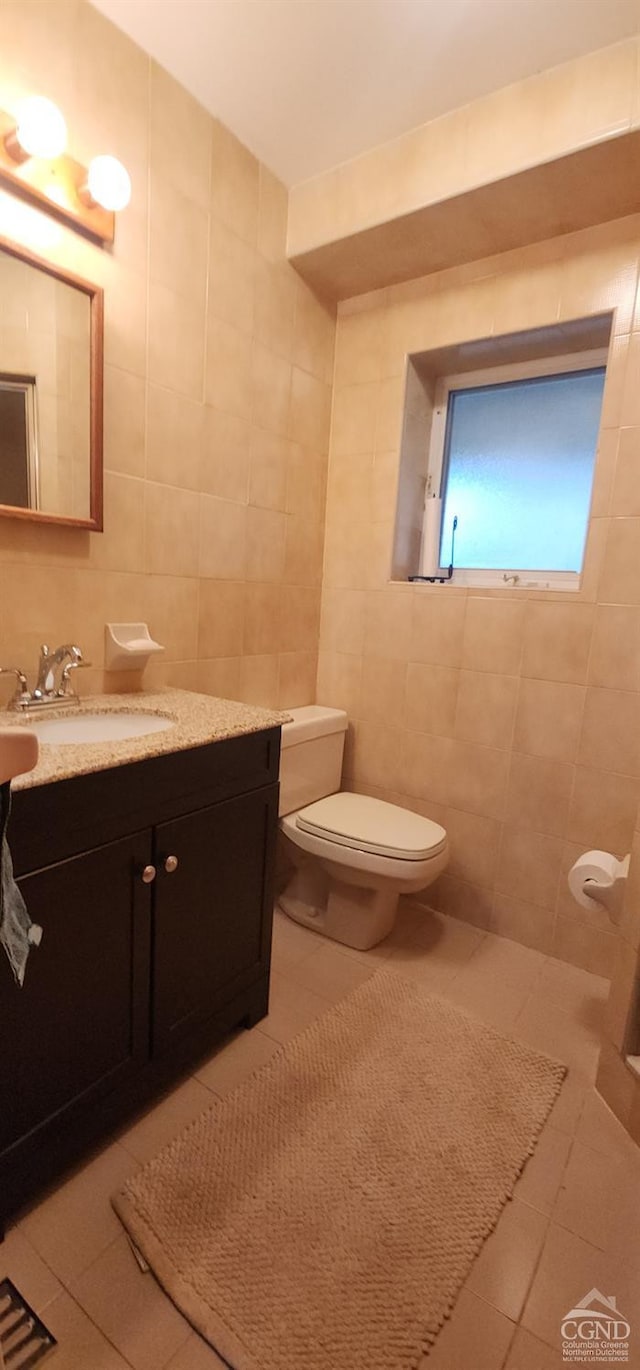 273 E Conesville Rd, Conesville, NY 12076 - bathroom featuring tile walls, tile patterned flooring, and vanity